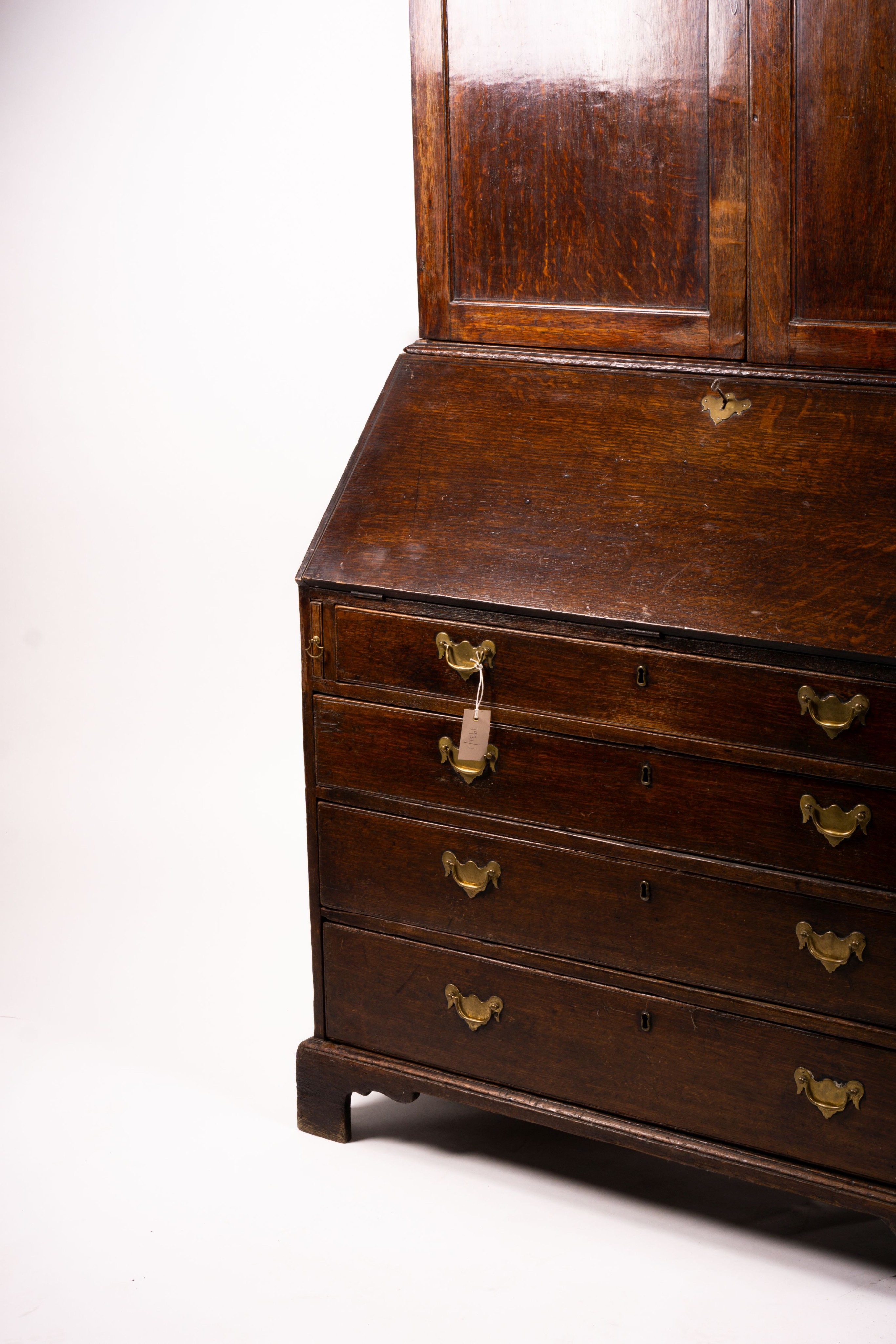 A George III oak bureau cabinet, width 108cm, depth 52cm, height 209cm